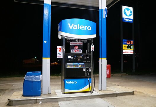 Odessa, Delaware, U.S - May 17, 2025 - A Valero gas pump stands illuminated against a dark night sky, displaying current fuel prices.