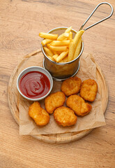 Fries with nuggets and ketchup