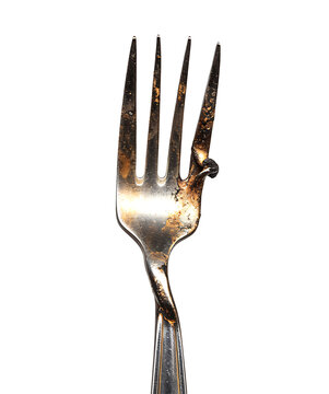 Close up of a damaged silver fork isolated on a transparent background 