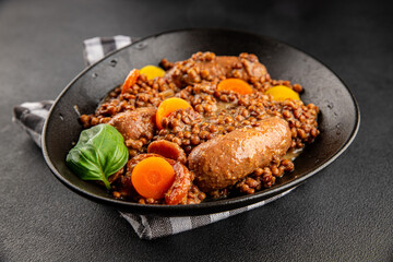 Sausage with lentils and vegetables appetizer vegetable dish fresh tasty gourmet food background on the table rustic food top view copy space