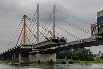 Construction work on a highway bridge over the river Rhine in Duisburg, Germany, under cloudy skies