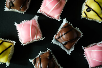 A Selection of Iced Individual Iced Sponge French Fancies Cakes