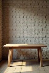 Rustic wooden table against a textured white brick wall bathed in sunlight