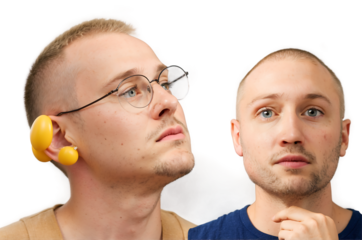 Two young men side by side different hairstyles