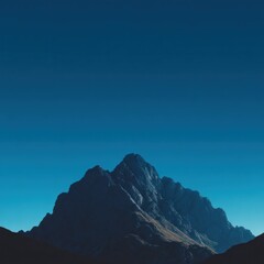 Fototapeta premium Mountain silhouette against blue sky