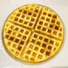 belgian waffles with maple syrup on a plate