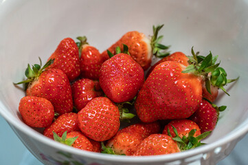Juicy strawberry on a plate.