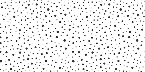 Modern black and white dotted seamless pattern. Random scattered circle dots in different sizes. Abstract dynamic background. Ideal for fabric print, wrapping, textiles, packaging, wallpapers © Svetlana