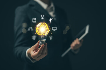 E-learning graduate certificate program concept.Woman holds a light bulb showing a brain icon. Concept of finding educational opportunities. Education Creativity and problem solving.