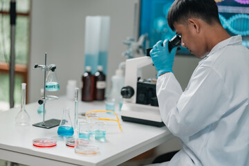 Researchers collaborate in a cutting-edge DNA laboratory, analyzing samples on petri dishes to explore genetic structures and decode molecular data for innovative scientific breakthroughs