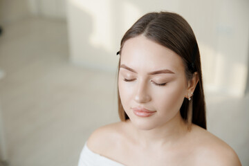 Portrait female after correcting wax of eyebrows and tinting brows