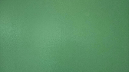 Green painted wall for background. Colorful of concrete wallpaper.