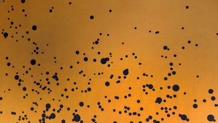 Abstract yellow with pattern black dot painted wall background or art wallpaper.