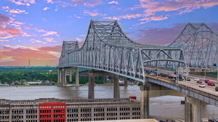 aerial shot of cars and truck driving on the Crescent City Connection bridge over the Mississippi...