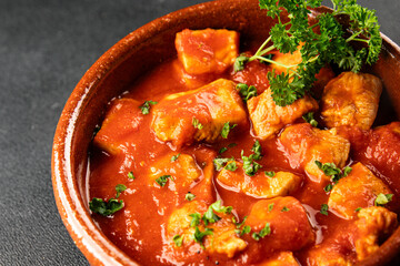 Butter chicken curry poultry meat tomato sauce dish fresh tasty gourmet food background on the table rustic food top view copy space