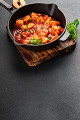 Butter chicken curry poultry meat tomato sauce dish fresh tasty gourmet food background on the table rustic food top view copy space