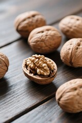 Fresh walnuts scattered on a rustic wooden surface natural healthy food ingredients