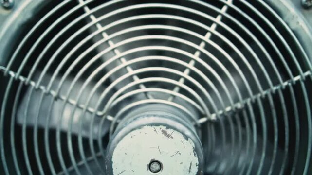 Close-up of Industrial Fan Blades and Grill