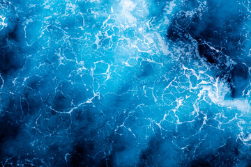Sea water surface texture. Aerial view of stunning water with foam. Can be used in covers, packaging, posters, textures, banners, art, and design projects. Creative nature background image.