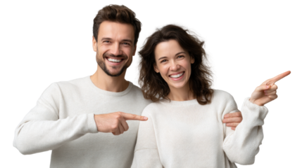 A man and woman are smiling and pointing to the right