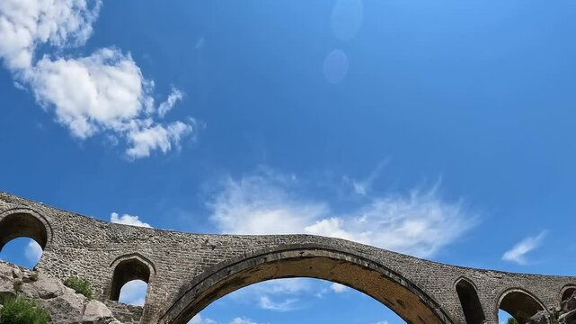 A view of the Ottoman Mesi Bridge near Shkoder in northwestern Albania. Mesi bridge with tourists 