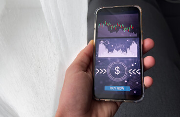 Businessmen work with stock market investments using smartphone to analyze trading data. smartphone with stock exchange graph on screen. Financial stock market.