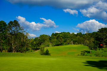 View of golf course with beautiful putting green.
