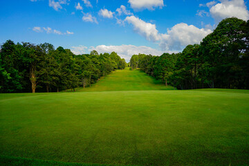 View of golf course with beautiful putting green.