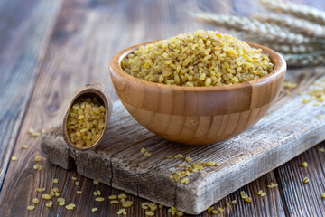 Bowl of Bulgur Wheat on Rustic Table.