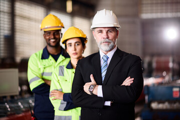 Portrait of Confident Factory Manager With Diverse Engineering Team Standing in Industrial Warehouse