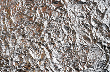 The texture of shiny aluminum foil close up