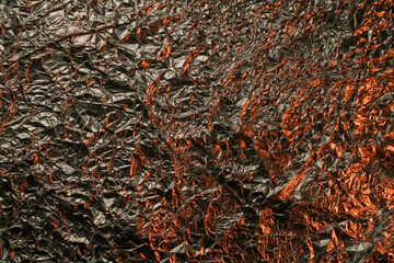 The texture of shiny aluminum foil close up