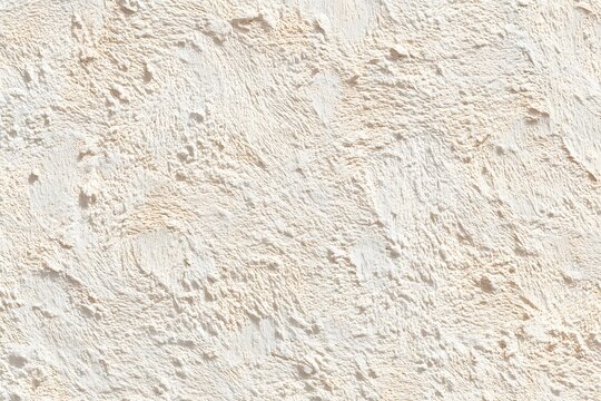 Rough Plaster Texture: The image captures a close-up view of rough plaster, highlighting its textured surface. Its patterns create a tactile experience that appeals to the eye.