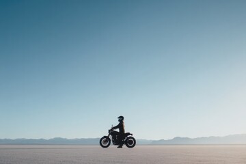 single motorbike enthusiast stands in wide expanse helmet on wearing casual riding gear
