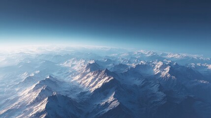 aerial top-down drone shot of majestic mountain peaks and valleys casting shadows across landscape