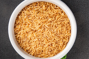 Brown rice whole grain cereal healthy product superfood fresh tasty gourmet food background on the table rustic food top view copy space keto and paleo diet vegetarian and vegan food