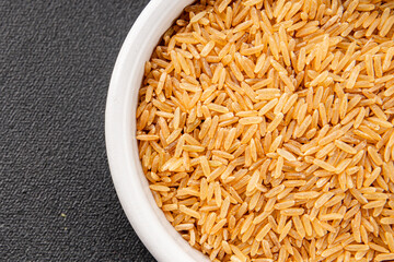 Brown rice whole grain cereal healthy product superfood fresh tasty gourmet food background on the table rustic food top view copy space keto and paleo diet vegetarian and vegan food