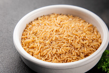 Brown rice whole grain cereal healthy product superfood fresh tasty gourmet food background on the table rustic food top view copy space keto and paleo diet vegetarian and vegan food