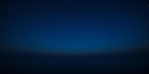 Vast blue night sky, stars above calm ocean Ample copy space, horizon, landscape