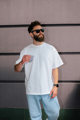 White T-shirt on a bearded hipster in sunglasses — urban mockup for brands