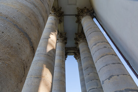 Stone columns in portico of facade medieval church, bottom view