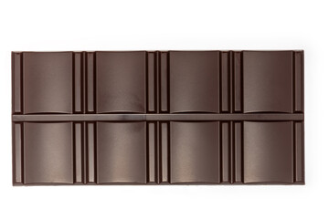 Bar of dark chocolate on white background, top view