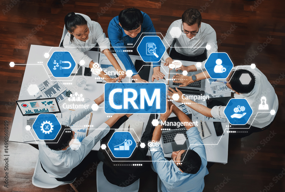 Poster A diverse team collaborates on business strategy, showcasing CRM concepts. They engage in discussions around customer management and service optimization in a modern workspace. Amity