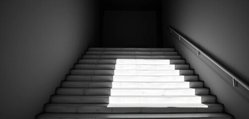 Obraz premium Stark monochrome image of sunlit concrete stairs, shadow play, minimalist architectural detail, modern, space