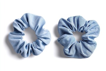 Two denim scrunchies with gathered fabric create a stylish accessory for hair.