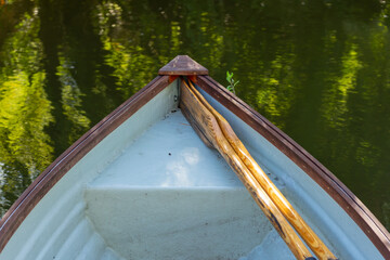 Colorful boat resting on the lake with two oars © SGY Photo