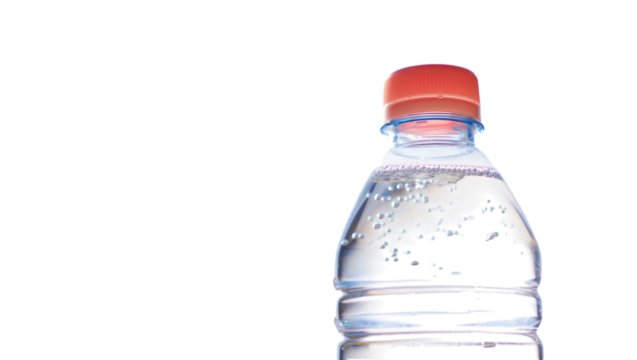 Close up of a plastic water bottle with a red cap isolated on transparent background