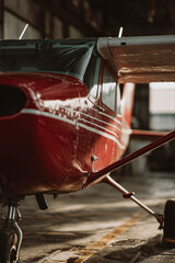 Light aircraft inside the hangar with the sun trapped inside the hangar