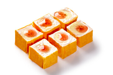 Sweet sushi rolls with exotic fruits and cream cheese filling on white background