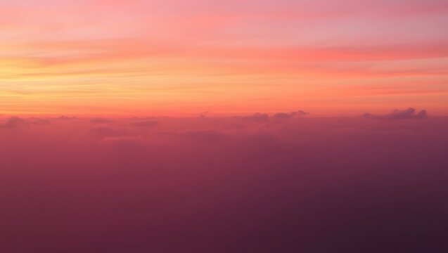 Aerial view of a vibrant sunset over a sea of clouds - Powered by Adobe